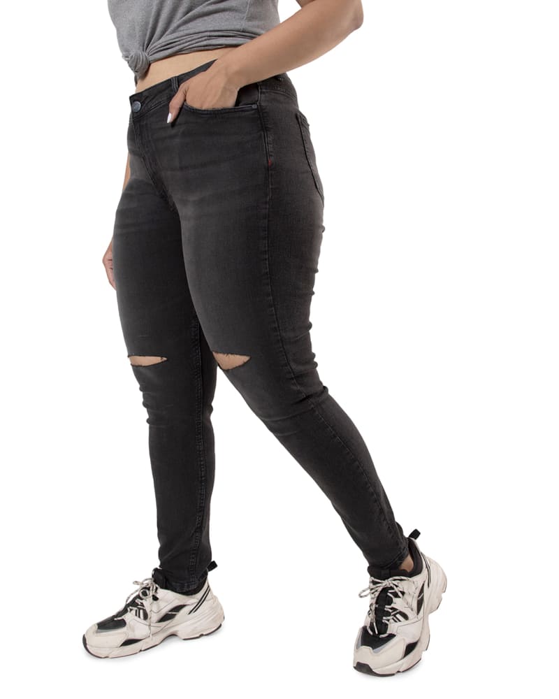 Side of a model wearing a size 42 PLUS SIZE WOMEN TORN CASUAL BLACK JEANS in Black by Instafab Plus. | dia_product_style_image_id:294335